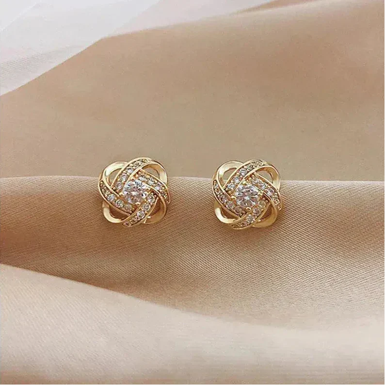 Gouden spiralen oorbellen met kristallen
