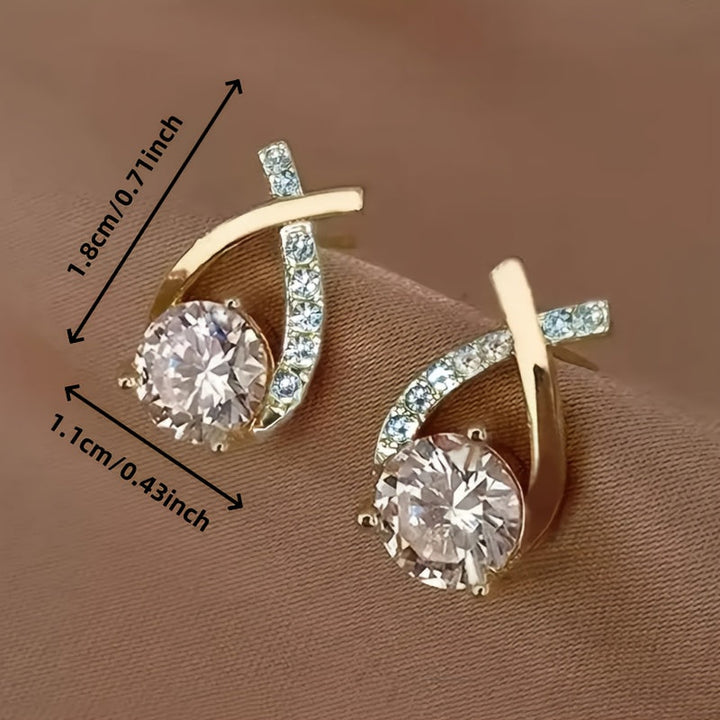 Oorbellen met gouden kruis en zirconia