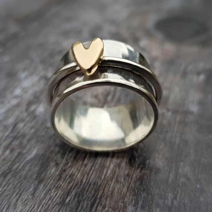 Zilveren ring met gouden hart