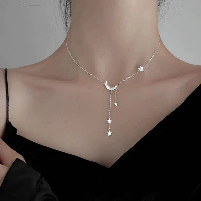 Elegante zilveren collier met maan en sterren