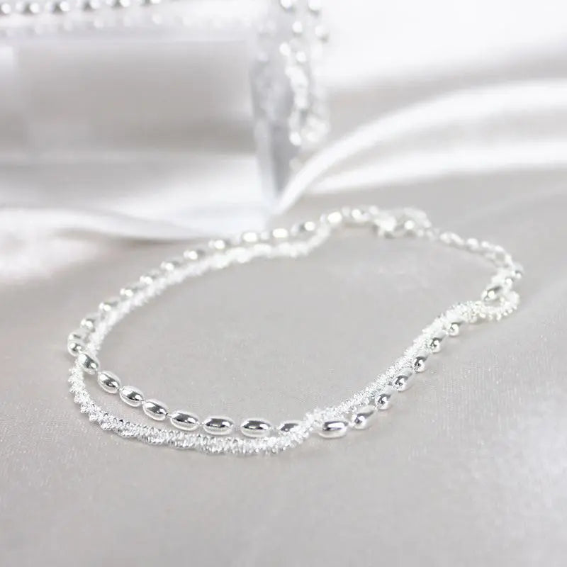 Elegante zilveren armbanden set met zirconium stenen