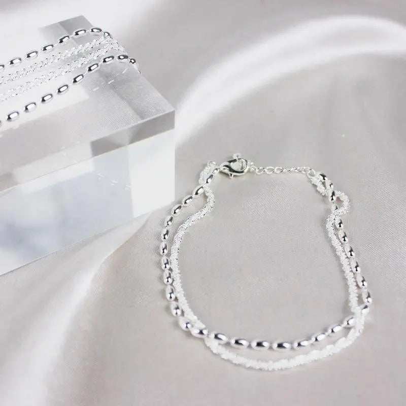 Elegante zilveren armbanden set met zirconium stenen
