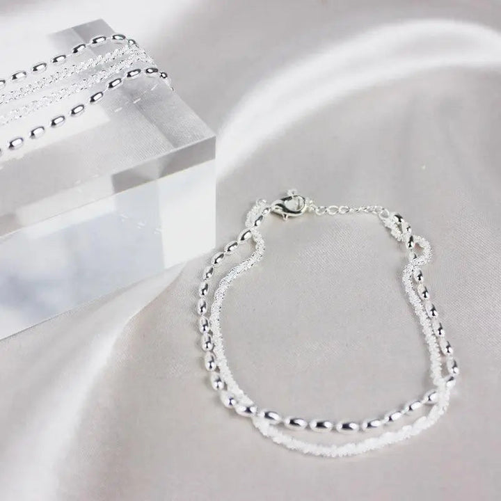 Elegante zilveren armbanden set met zirconium stenen
