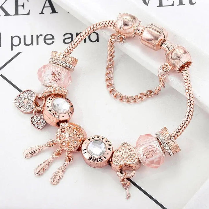 Roze Dromenvanger Armband met Inclusief Zilveren Charms