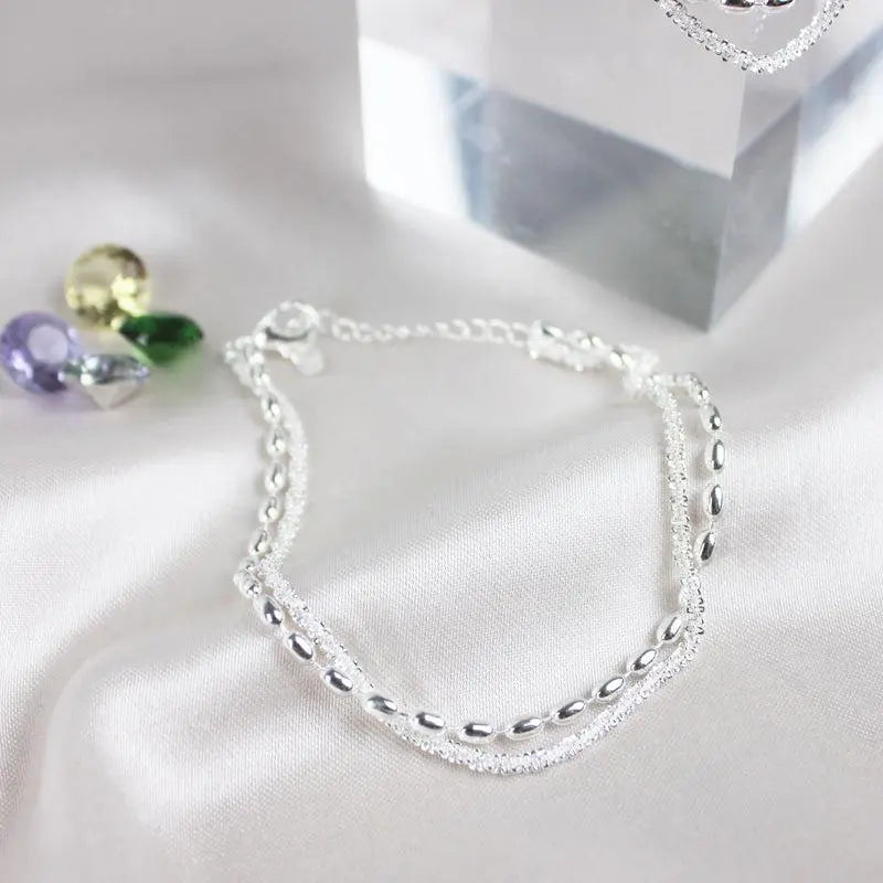 Elegante zilveren armbanden set met zirconium stenen