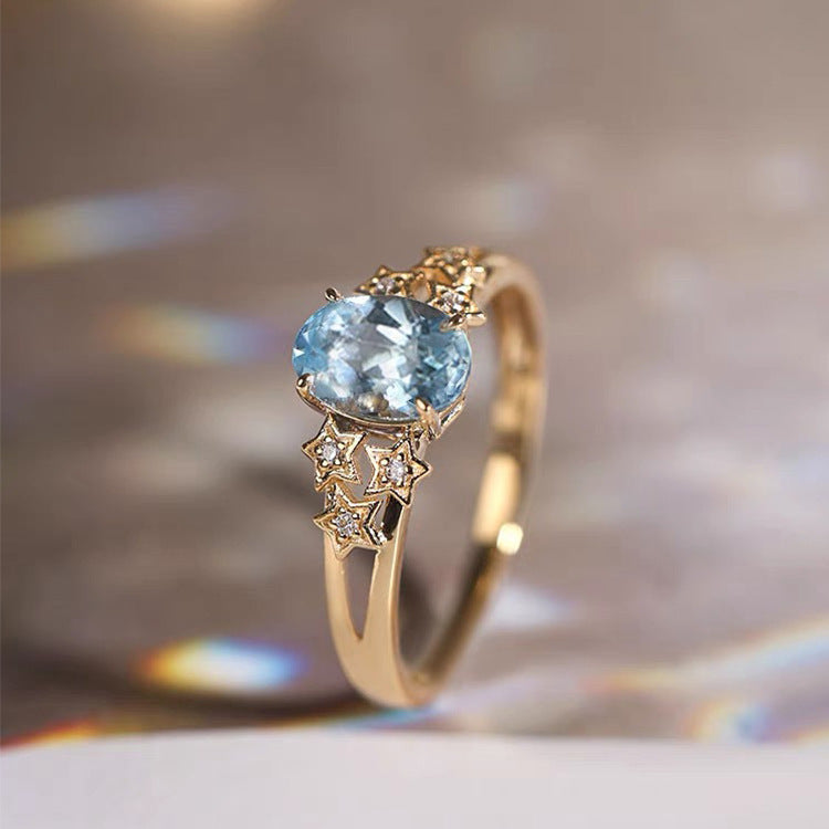 Exclusieve gouden ring met blauwe kristal